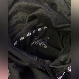 It is a black with a white Nike symbol Nike hoodie